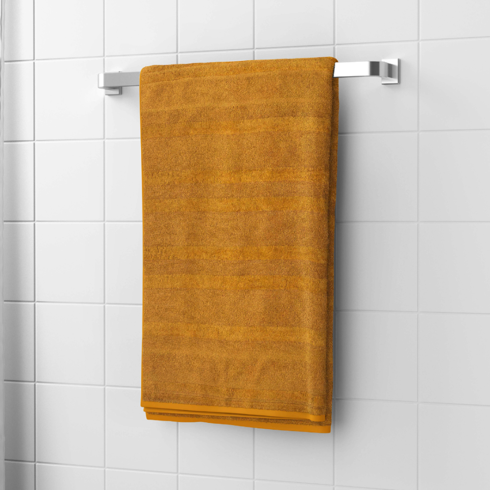 Vonios rankšluostis „Terry Mustard“. Rankšluosčiai, 50x90 cm, 70x140 cm. Prabangus garstyčių spalvos medvilninis vonios rankšluostis, pliušinis ir patvarus, suteikiantis jaukumo ir elegancijos jūsų kasdienei vonios rutinai.