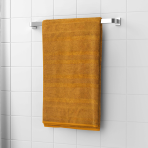 Vonios rankšluostis „Terry Mustard“. Rankšluosčiai, 50x90 cm, 70x140 cm. Prabangus garstyčių spalvos medvilninis vonios rankšluostis, pliušinis ir patvarus, suteikiantis jaukumo ir elegancijos jūsų kasdienei vonios rutinai.